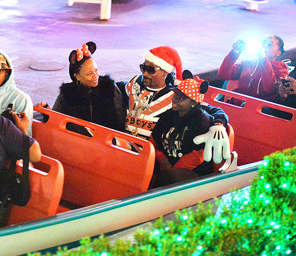 EXCLUSIVE: Snoop Dogg and family enjoy Christmas night at Disneyland in Anaheim, CA